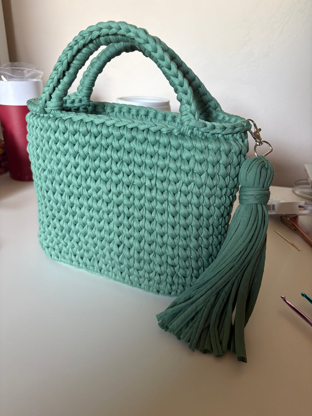 Handmade crocheted tote bag with tassel