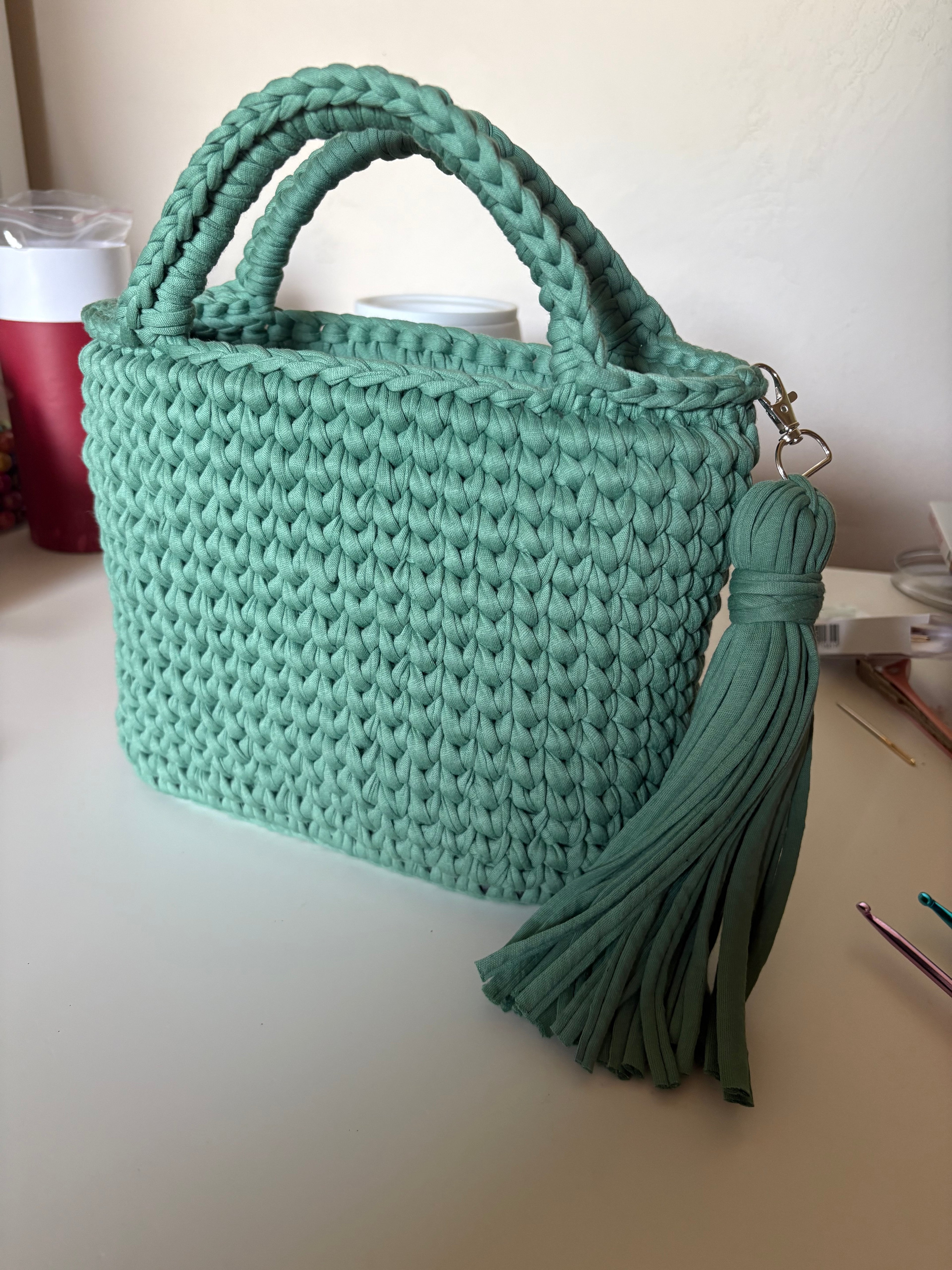 Handmade crocheted tote bag with tassel