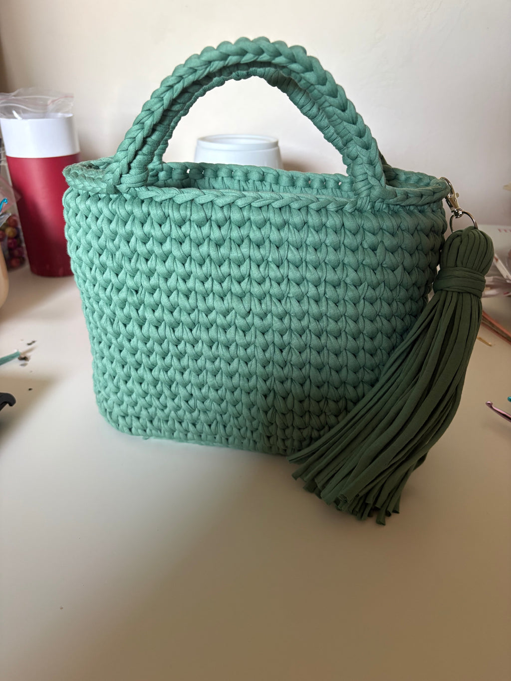 Handmade crocheted tote bag with tassel