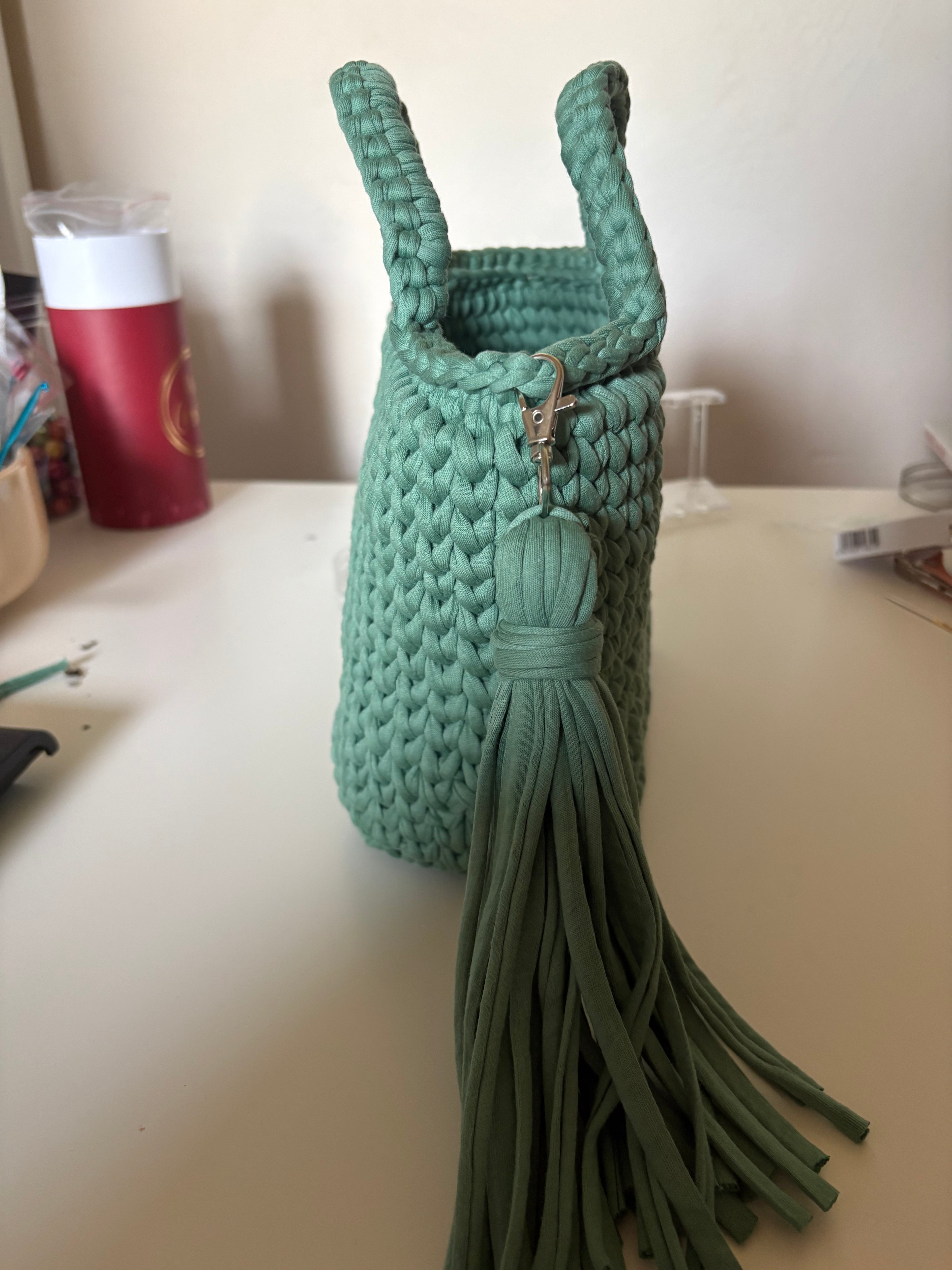 Handmade crocheted tote bag with tassel